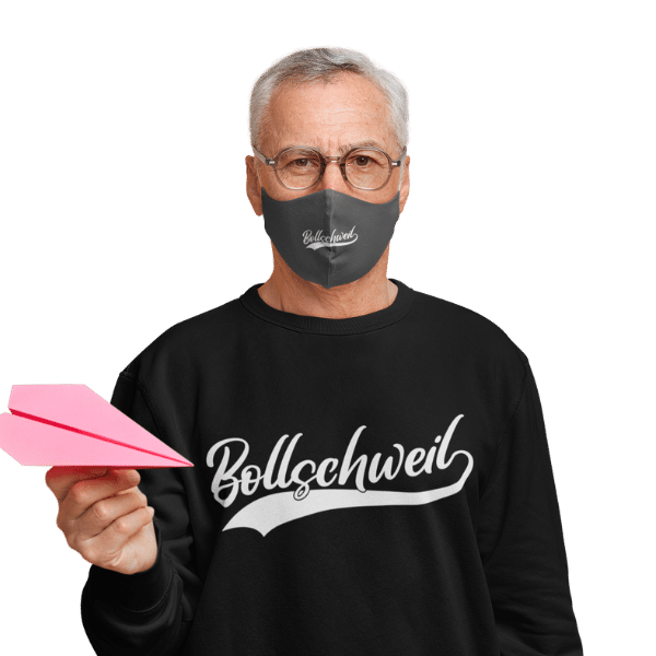 mann mit gesichtsmaske und schwarzem t-shirt mit bollschweil motiv